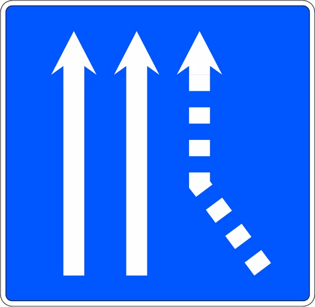 Traffic merges from the right onto a two-lane carriageway
