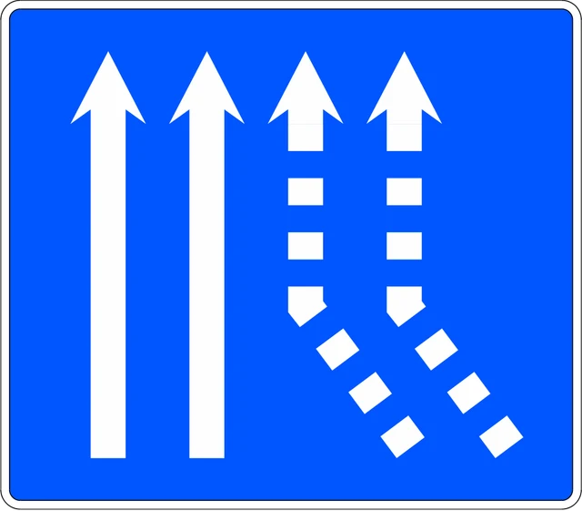 Two lanes merge from the right onto a two-lane carriageway